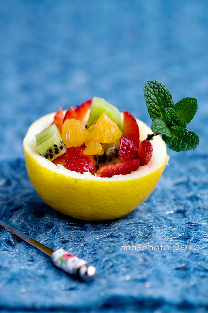 Fruit salad in lemon bowl 