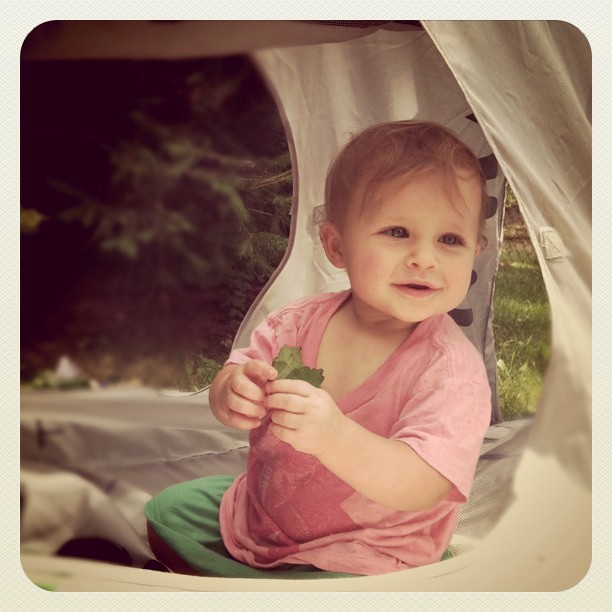 Baby girl in a tent.