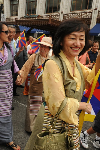 Stylish in her chuba, Tibetan people parade for World Peace with Tibetan Flags, near Verizon Center where Kalachakra is being given by His Holiness the 14th Dalai Lama, Washington D.C., USA 2478 by Wonderlane