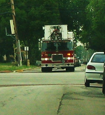 A Norwood Park Fire Department tower truck returning to base.  Harwood Heights Illinois USA. July 2011. by Eddie from Chicago