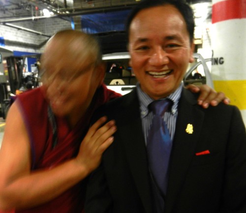 Affection and delight, two friends backstage preparing for the mandala offering to His Holiness 14th Dalai Lama of Tibet, Kalachakra for World Peace, Verizon Center, Washington D.C., USA by Wonderlane