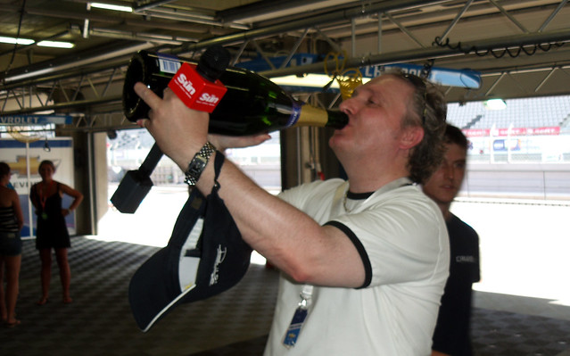 Jim Munro drinks Rob Huff's Champagne