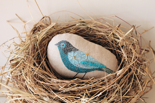 Nest with embroidered bird