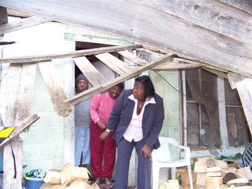 Mississippi’s USDA Rural Development State Director Trina George tours the old home of Ms. Monger in January 2011.