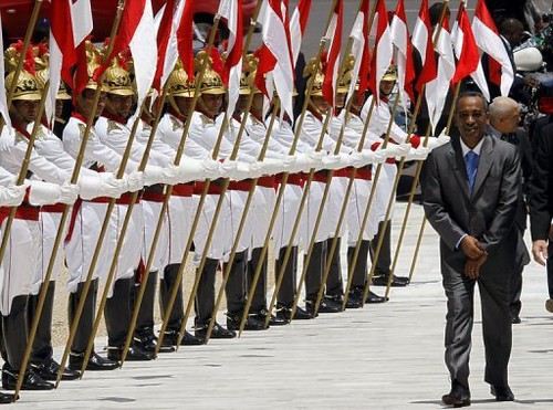 Prime Minister of Sao Tome Joachim Rafael Branco facing the honor guard in his country. The country will undergo national elections very soon. by Pan-African News Wire File Photos
