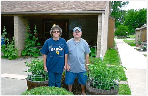 Kirkendall Heights, located in Ellsworth, Kan., developed new whiskey barrel gardens.  Residents Betty Jo and Eric are proud to show off their new gardens.  