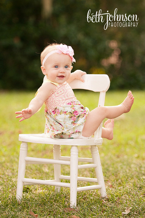 nine month old baby girl in chair at maclay gardens