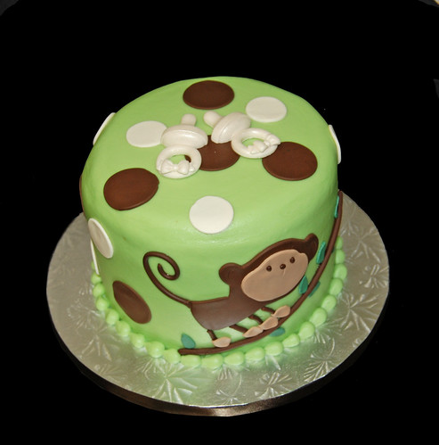 green and brown monkey baby shower cake for twins 2 pacifiers