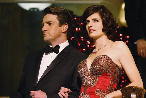 Castle and Beckett very dressed up, arm in arm