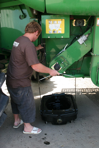 Johan prepare to change the oil on the combine