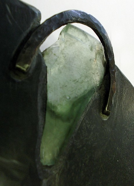 Raw detail: unearthed bottle glass, forged stainless steel 