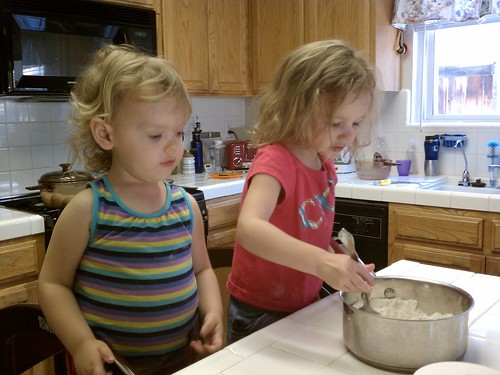 Lily and Livi helping make playdough