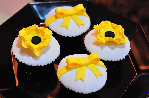 Bright yellow black and white wedding cupcakes