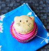 Hello Kitty Macarons on Strawberry Banana Cupcakes