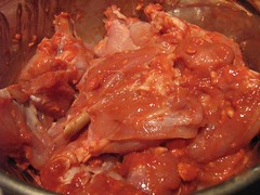 Chicken marinating in red bean curd paste