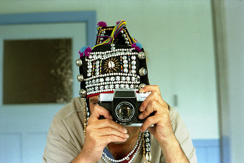 reflected self-portrait with Fujicarex camera and Thai hat by pho-Tony