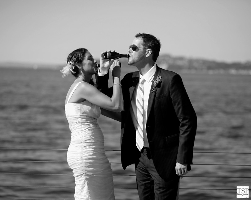 Bride and Groom Drink Arm in Arm