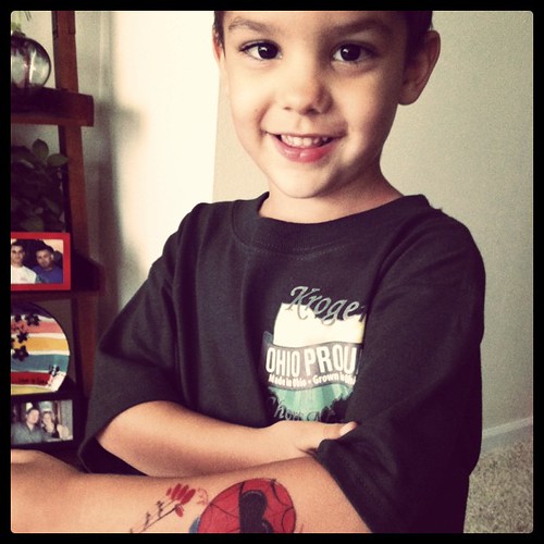 Showing off his spiderman tattoo :)