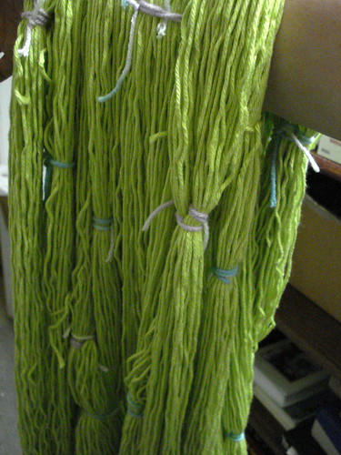Secure tied hanks skeins of yarn yellow green