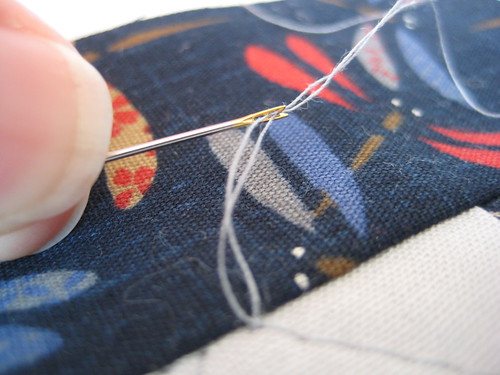 Self-threading needle tute