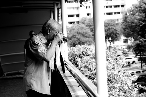 Elderly man with camera