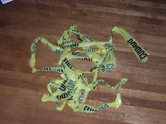 A broken tentacle of yellow caution tape
