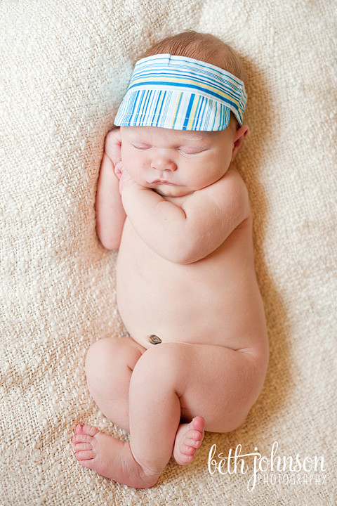 newborn baby boy in viser hat