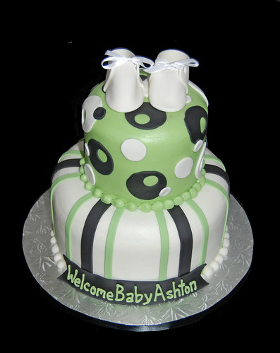 green and black 2 tier baby shower cake with booties