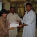 Shaukat Khattak receiving certificate from Puruesh Chaudhary, CIME Ambassador to Pakistan