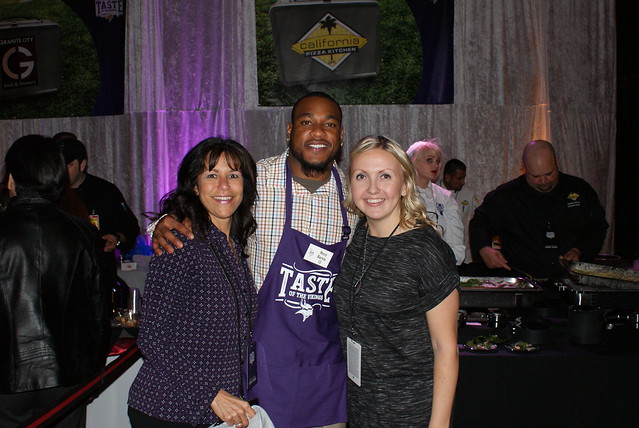 PERCY HARVIN with Second Harvest Heartland employees Lindsi and Heidi