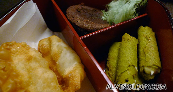 Close-up of the items in the left bento box