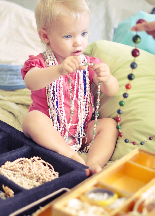 delilah trying on nana's vintage  necklaces