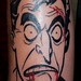 Joker face tattoo
