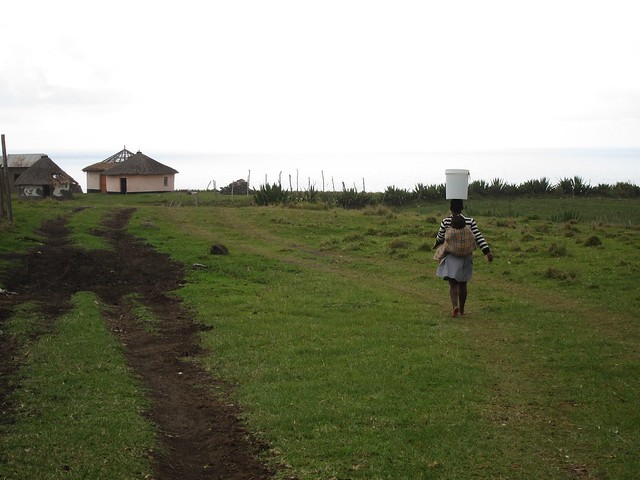 Woman Carrying Water in Xhosa Village