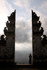 Waiting for the Clouds to Break (DrTH80) Tags: shadow bali woman dog sunlight mountain silhouette clouds indonesia temple volcano gate profile gunung volcanic pura clouded shadowed agung lempuyang