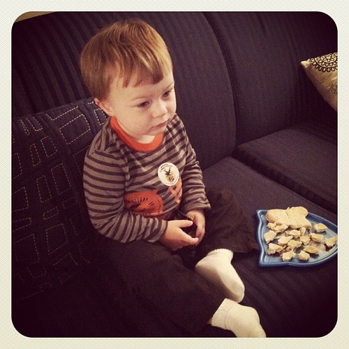 Too engrossed in Cars 2 to eat his sandwich and pretzels ;)