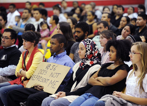 Oct. 13, 2011 photo, people listen to others voice their concerns about the Alabama HB56 law at a town hall meeting at Glen Iris Elementary School in Birmingham, Ala. by Pan-African News Wire File Photos