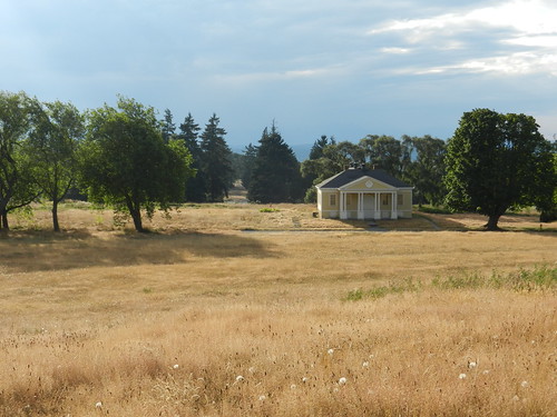 Fort Lawton historical gymnasium, holy ground, yellow grassy field, trees, Discovery Park, Seattle, Washington, USA by Wonderlane