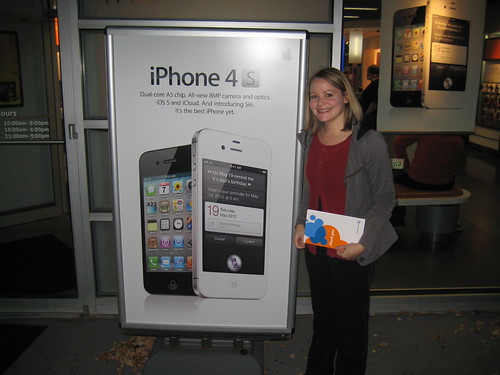 me with iPhone 4S sign outside of AT&T store