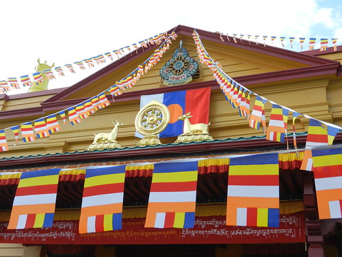 Sakya Monastery of Tibetan Buddhism, Buddhist flags, prayer flags, Dharma deer and wheel, banner, Greenwood, Seattle, Washington, USA by Wonderlane