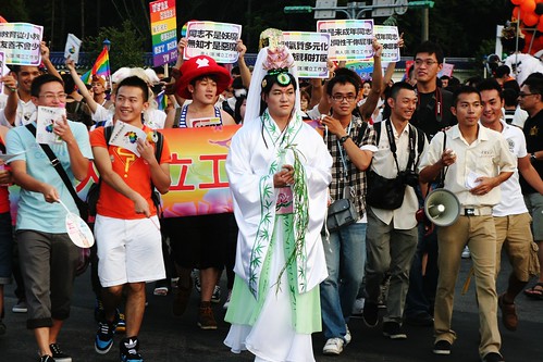 Some religious group are against informing youth about LGBT in schools. A parade participant plays ‘Guanyin (觀世音菩薩)', a bodhisatta regarded as both male and female, to demonstrate that ‘even gods can be LGBT'.