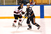 Ice Hawks #21 Mark Whiteley skates by Devils #18 Stephen Campbell