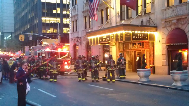 Firefighters at the entrance to the Warwick Hotel