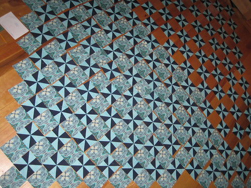 pinwheel quilt on the floor