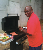 Local 52031 activist Kenny Distance grills lunch on “Hot Dog Wednesday,” a regular event that kept morale high for NABET-CWA members at PBS.