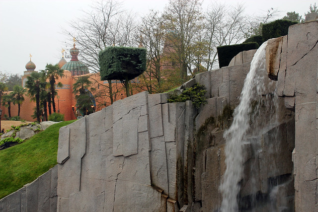 ADVENTURELAND looming behind the waterfall of Sleeping Beauty Castle