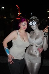 Two women pose dressed as Leela and Bender from Futurama