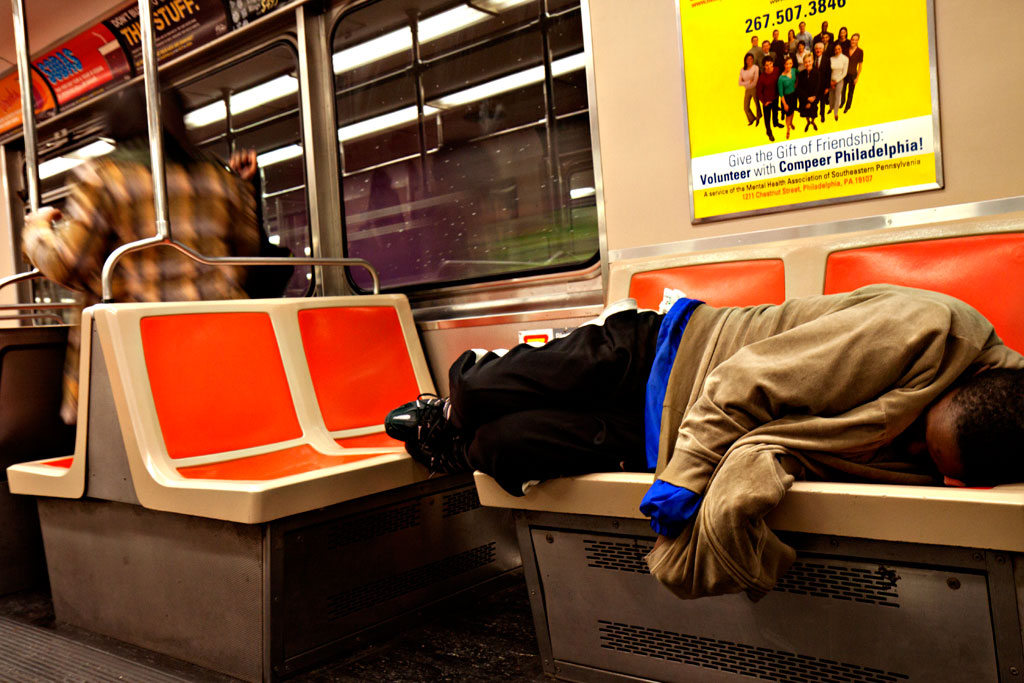 Man-sleeping-on-subway-train-on-11-16-11--Center-City