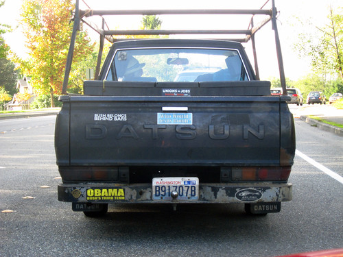 Senior's Datsun pickup with political stickers red 1982 datsun pickup