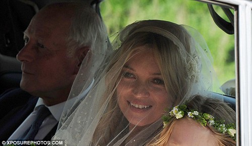  The first look at Kate Moss as she arrives at St Peter's parish church for her wedding